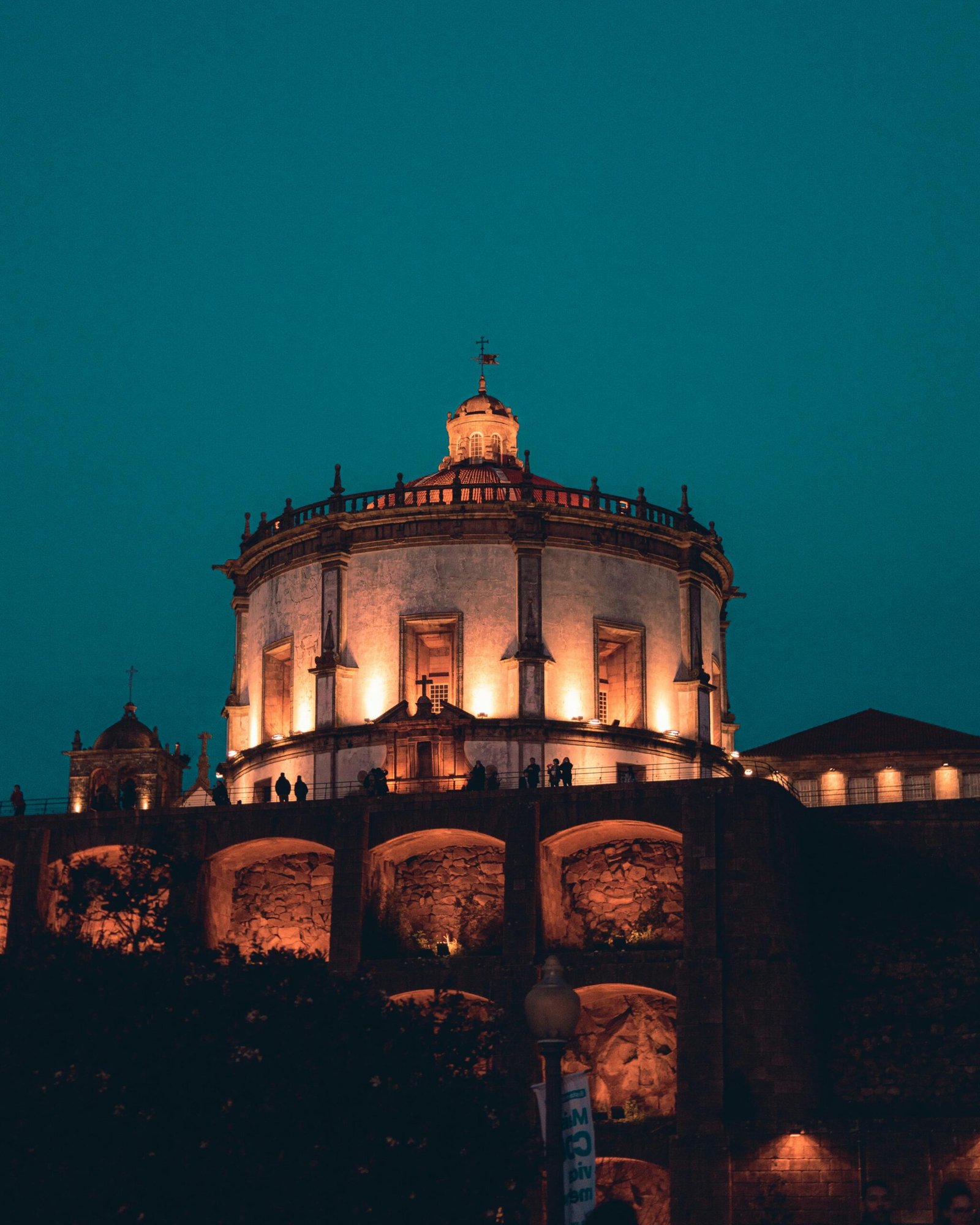 Beautiful twilight view of the illuminated Serra do Pilar Monastery in Porto, Portugal.
